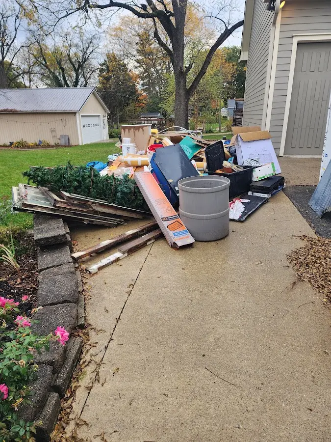 Dumpster being loaded with debris for Commercial Dumpster Rental in Fayetteville